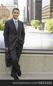 Portrait Of Businessman Standing Outside Office