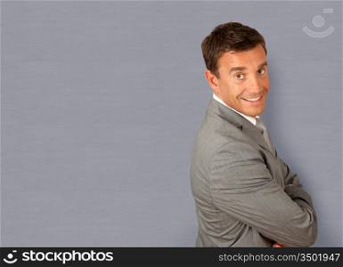 Portrait of businessman standing with arms crossed
