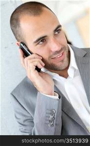 Portrait of businessman using mobile phone