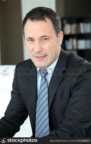 Portrait of businessman wearing dark suit