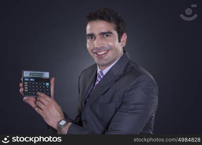 Portrait of businessman with calculator