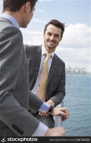 Portrait of businessman with coworker on terrace