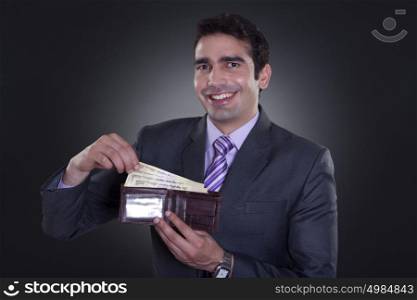 Portrait of businessman with currency in wallet