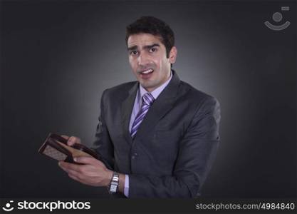 Portrait of businessman with empty wallet