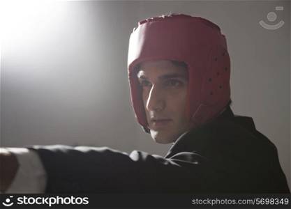 Portrait of businessman with protective headgear