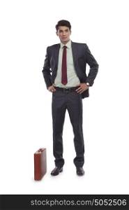 Portrait of businessman with suitcase