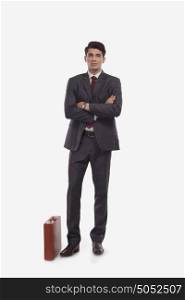 Portrait of businessman with suitcase