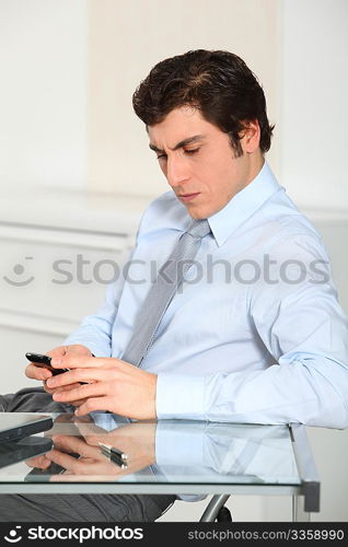 Portrait of businessman with telephone