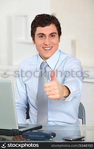 Portrait of businessman with thumb up