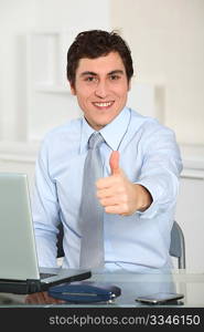 Portrait of businessman with thumb up