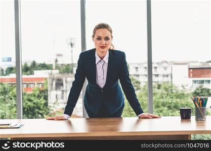 Portrait of businesswoman executive leader at office looking at camera.
