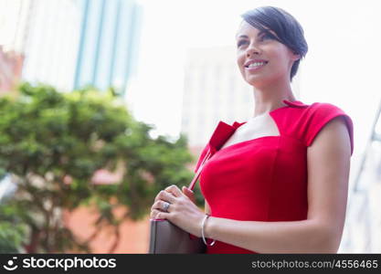 Portrait of businesswoman outside. Portrait of beautiful business woman in red dress