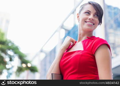 Portrait of businesswoman outside. Portrait of beautiful business woman in red dress