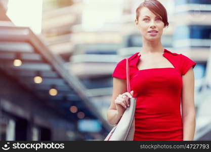 Portrait of businesswoman outside. Portrait of beautiful business woman in red dress