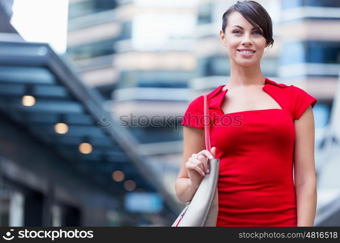 Portrait of businesswoman outside. Portrait of beautiful business woman in red dress