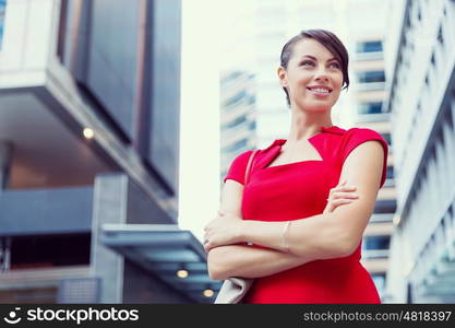 Portrait of businesswoman outside. Portrait of beautiful business woman in red dress