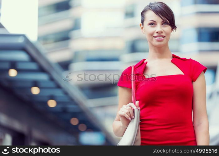 Portrait of businesswoman outside. Portrait of beautiful business woman in red dress