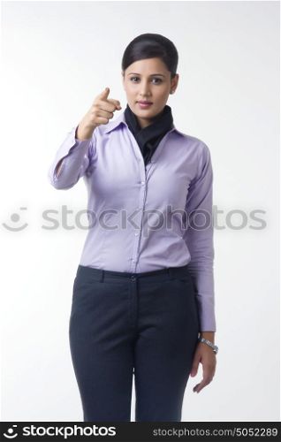 Portrait of businesswoman pointing