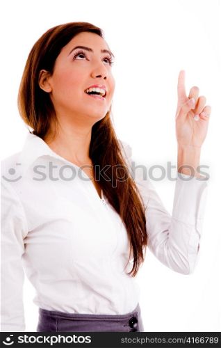 portrait of businesswoman pointing up on an isolated white background