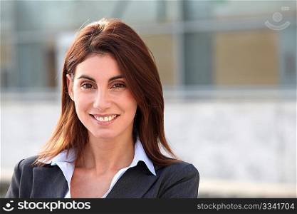 Portrait of businesswoman standing outside