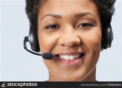 Portrait Of Businesswoman Wearing Telephone Headset In Customer Services Department                               