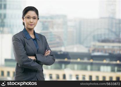 Portrait of businesswoman with arms folded