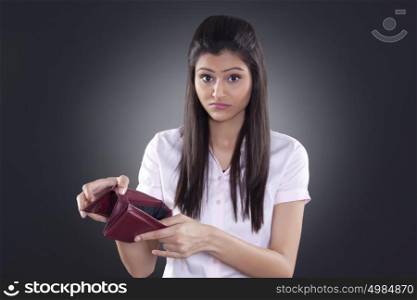 Portrait of businesswoman with empty wallet