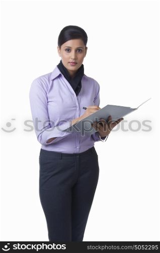 Portrait of businesswoman with file