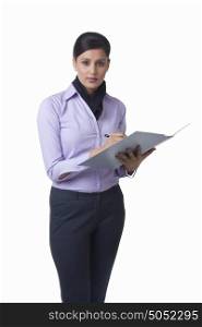 Portrait of businesswoman with file