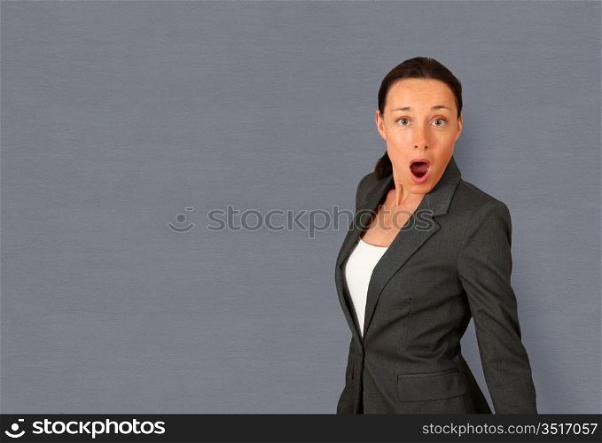 Portrait of businesswoman with surprised look