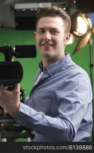 Portrait Of Cameraman Working In Television Studio