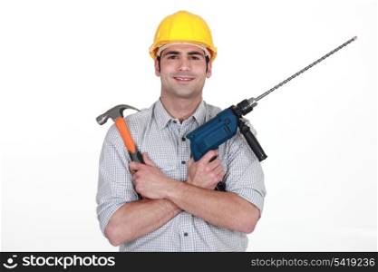 portrait of carpenter holding hammer and drill isolated on white