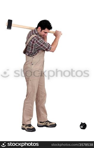 portrait of carpenter isolated on white breaking piggy bank with hammer