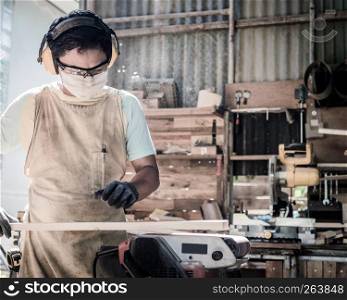 Portrait of carpenter man with him job