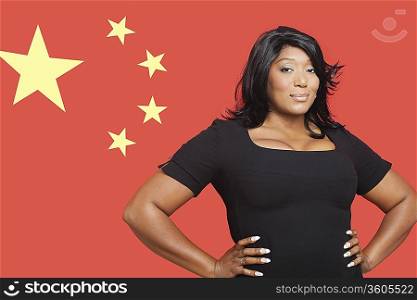 Portrait of casual mixed race woman against Chinese flag