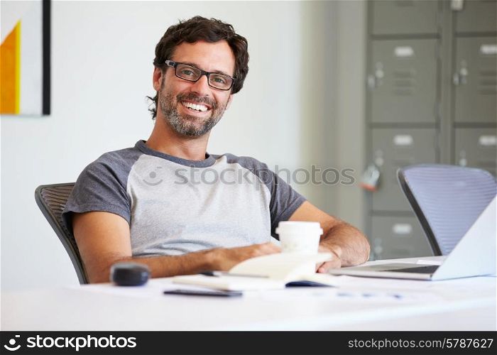 Portrait Of Casually Dressed Man Working In Design Studio