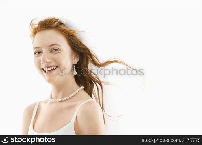 Portrait of Caucasian bride with blowing hair.
