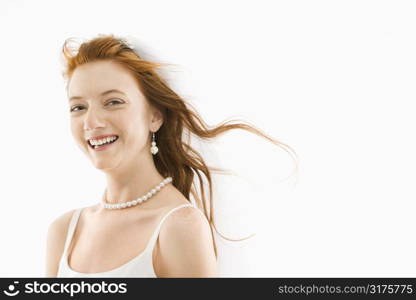 Portrait of Caucasian bride with blowing hair.