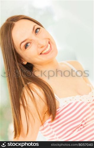 Portrait of caucasian brunette smiling woman
