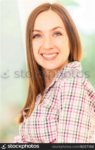 Portrait of caucasian brunette smiling woman
