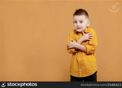 portrait of caucasian scared child boy on yellow background. amazed stressed boy in yellow shirt. school child afraid or shocked. surprised kid with fear and excited face. good and bad news.. portrait of caucasian scared child boy on yellow background. amazed stressed boy in yellow shirt. school child afraid or shocked. surprised kid with fear and excited face. good and bad news
