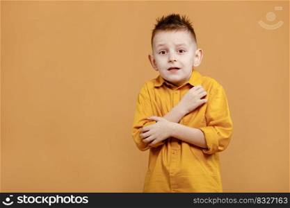 portrait of caucasian scared child boy on yellow background. amazed stressed boy in yellow shirt. school child afraid or shocked. surprised kid with fear and excited face. good and bad news.. portrait of caucasian scared child boy on yellow background. amazed stressed boy in yellow shirt. school child afraid or shocked. surprised kid with fear and excited face. good and bad news