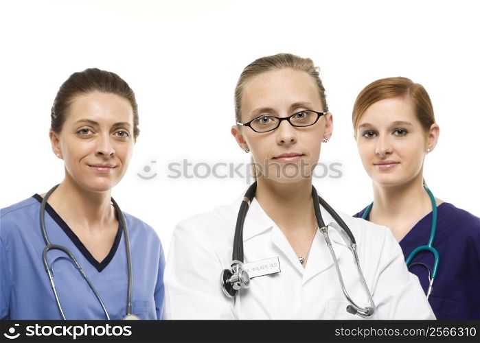Portrait of Caucasian women medical healthcare workers in uniforms against white background.