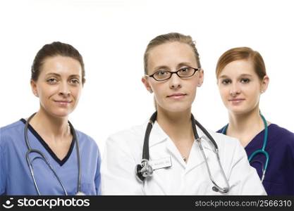 Portrait of Caucasian women medical healthcare workers in uniforms against white background.
