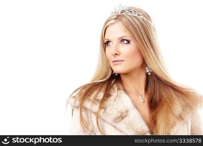 Portrait of charming blonde with a diadem on a head and the fur collar, isolated