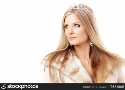Portrait of charming blonde with a diadem on a head and the fur collar, isolated