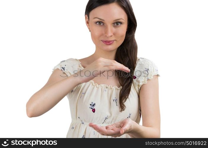 Portrait of charming young woman presenting your product over white background