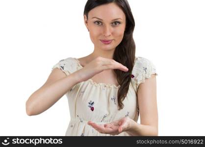 Portrait of charming young woman presenting your product over white background