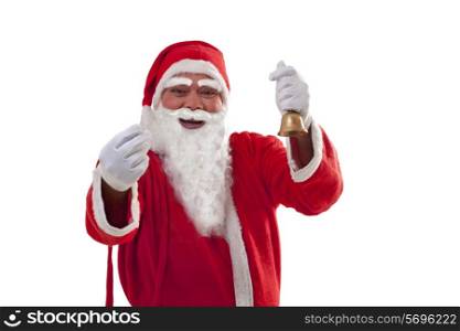 Portrait of cheerful Santa Claus gesturing while holding bell over white background