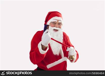 Portrait of cheerful Santa Claus showing chocolate over white background